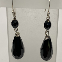 Faceted black beads with sterling silver wire.